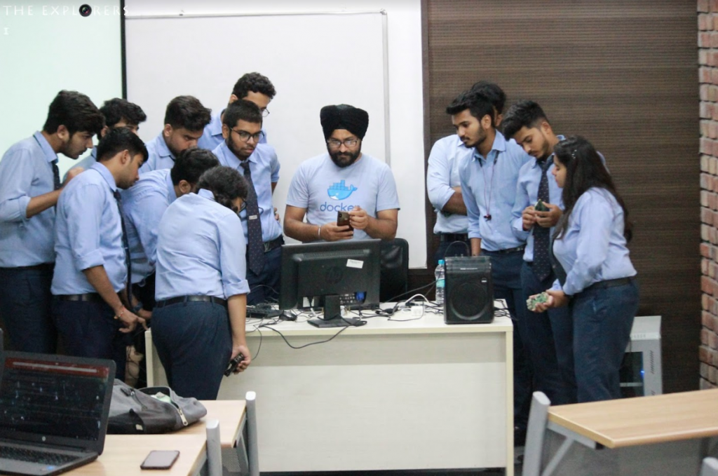 Students gathered around a workstation during the Docker workshop at UPES Dehradun